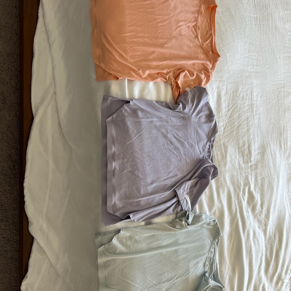 Three medium Alphalete t-shirts
